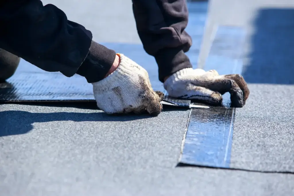 All Dry roofer installing flat roof membrane in Tucson