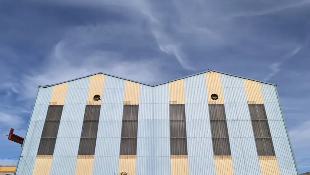 Metal roof on commercial warehouse building in Tucson Arizona